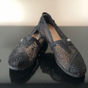 Black TOMS crotchet slip-on shoes